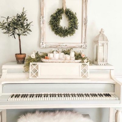 Painted piano with olive tree and wreath