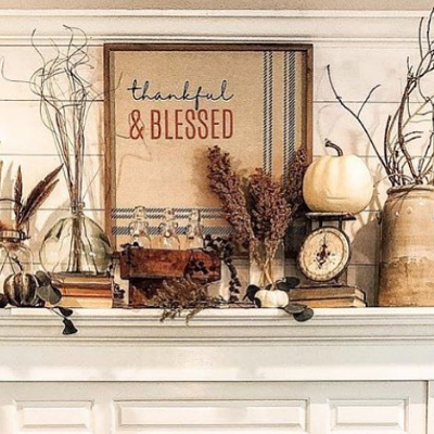 fall fireplace mantel featuring sticks,pumpkins and dried flowers