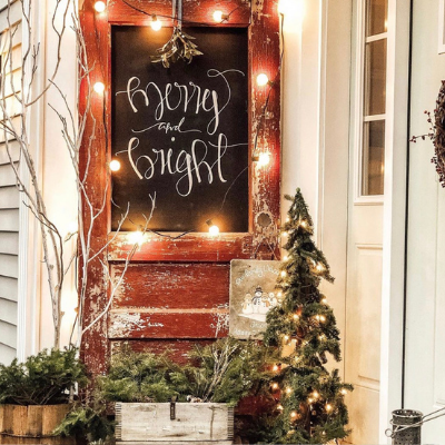 red door with chalk board and Christmas lights