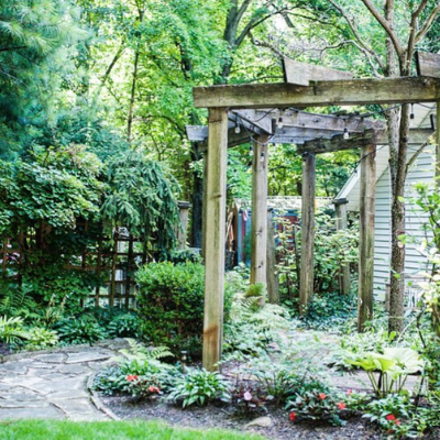 backyard bushes flowers and gazebo