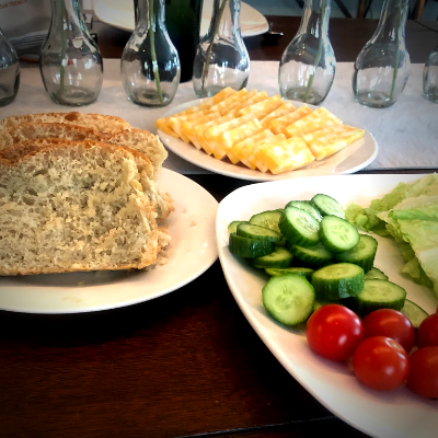 homemade bread slices, sliced cucumbers, tomatoes and cheese