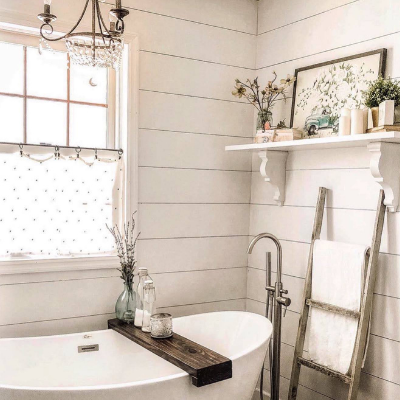 bathtub and shiplapped walls