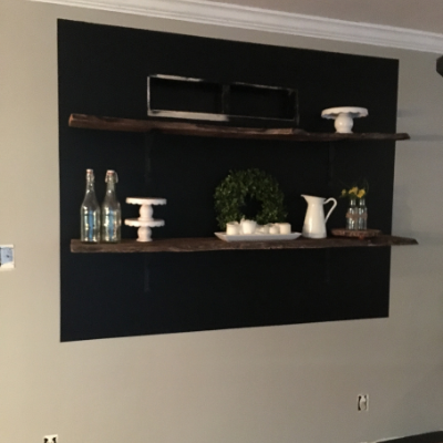 chalkboard with wooden shelves