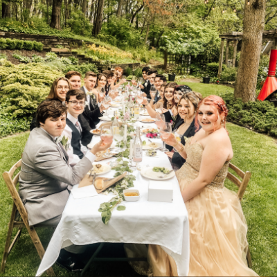 long table with people eating