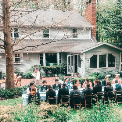 looking down over a backyard with people sitting at a table