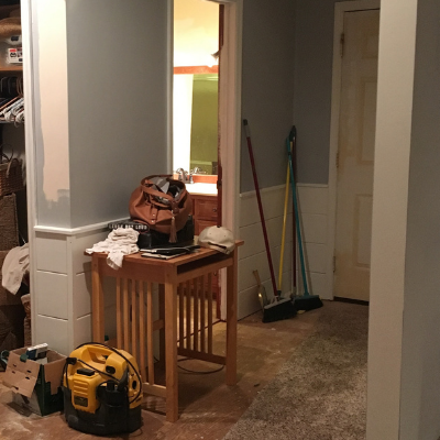 room with brooms and cleaning supplies 