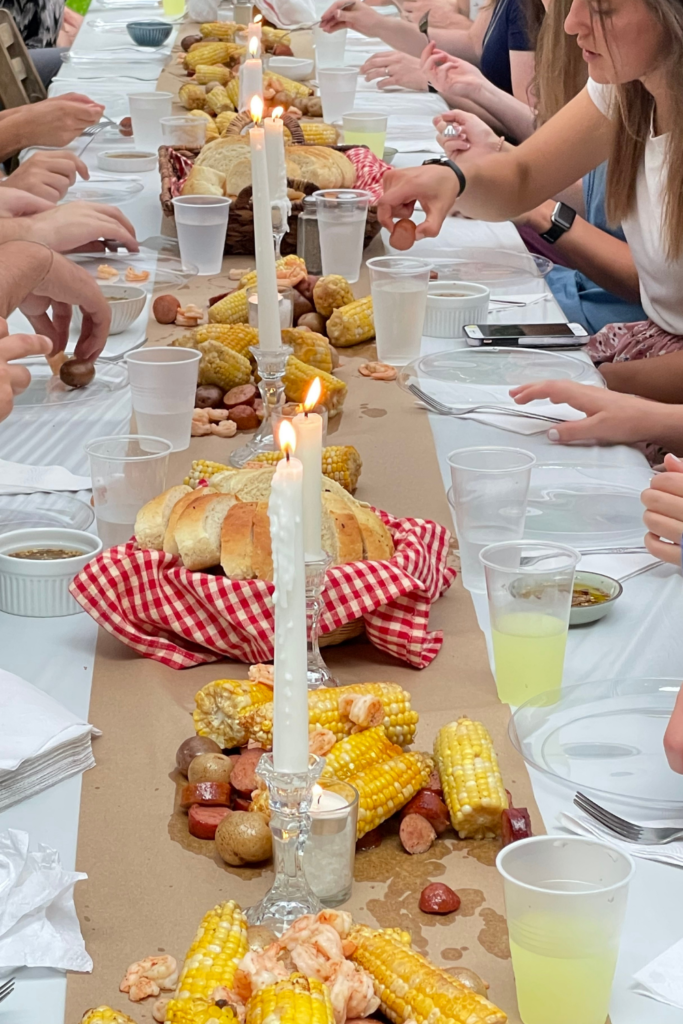 shrimp boil with candles on a table