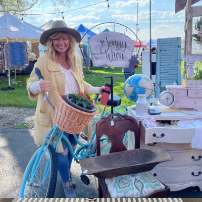 woman in hat by a bike 